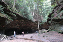 Hikers admire the massive rock formations at Turkey Run State Park near Marshall in scenic Parke County. The temperature is considerably cooler while walking in the rocky ravines that date back to prehistoric times. (File photo by Mary Ann Wyand) 