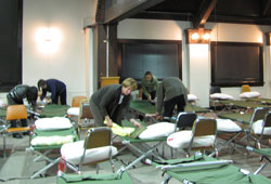 At the Interfaith Winter Shelter in Bloomington, volunteers worked together last winter to get beds ready for homeless people to spend the night. Parishioners at St. Paul Catholic Center in Bloomington will once again be involved in the shelter, which will be open overnight from Nov. 1 through March 31. (Submitted photo)