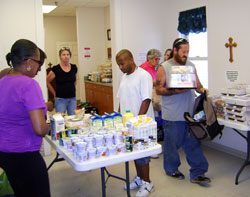 People in need receive food at Deli Days, a food pantry operated by Catholic Charities Terre Haute at its Bethany House Soup Kitchen in Terre Haute. Contributions to the “Christ Our Hope: Compassion in Community” annual appeal support Catholic Charities ministries across central and southern Indiana. (Submitted photo)