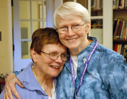 Louise Collet, left, and Providence Sister Susan Dinnin share an emotional hug on June 26, the last day that the longtime friends worked together at A Caring Place, the Catholic Charities Indianapolis program that provides adult day care services. (Photo by John Shaughnessy)