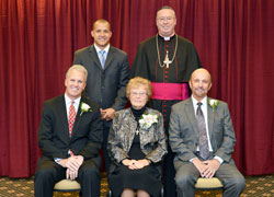 An archdiocesan celebration of Catholic education on Oct. 30 honored three individuals whose Catholic values mark their lives. Sitting, from left, are honorees Dennis Sponsel, Providence Sister James Michael Kesterson and Fred Klipsch. Standing, from left, are featured speaker Rodney Byrnes and Bishop Christopher J. Coyne, apostolic administrator of the archdiocese. (Submitted photo by Rob Banayote)