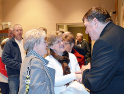 Archbishop Joseph W. Tobin greets Judy Hagedorn, left, and her daughter, JoAnn Smith, members of St. Mark Parish in Perry County, after celebrating Mass on Jan. 21 at St. Paul Church in Tell City. (Submitted photo courtesy of Vince Luecke, Perry County News)
