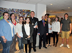 Archbishop Joseph W. Tobin and Professor Pierre Atlas, director of the Richard G. Lugar Franciscan Center for Global Studies at Marian University in Indianapolis, pose with global studies students on April 16 at Marian University. (Photos by Sean Gallagher)