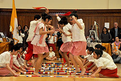 As part of the entertainment at the Intercultural Ministry Awards Dinner on Nov. 15 at the Archbishop Edward T. O’Meara Catholic Center in Indianapolis, Filipino children perform a traditional Philippine “tinikling” dance, in which they step, hop and jump over and between moving bamboo sticks. (Photo by Natalie Hoefer)