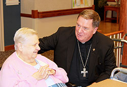 Archbishop Joseph W. Tobin visits with Providence Sister Mary Cecile Grojean on Aug. 19, 2014, at her community’s motherhouse at Saint Mary-of-the-Woods. (Photo courtesy of the Sisters of Providence of Saint Mary-of-the-Woods)