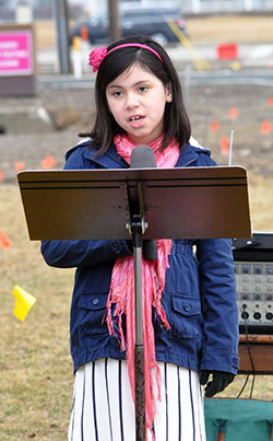 In front of the participants in the 40 Days for Life midpoint rally in Indianapolis on March 14, Sara Cabrera, 7, and a member of St. Ann Parish in Indianapolis, reads her letter to President Barack Obama asking him to change his views on abortion. (Photo by Natalie Hoefer)