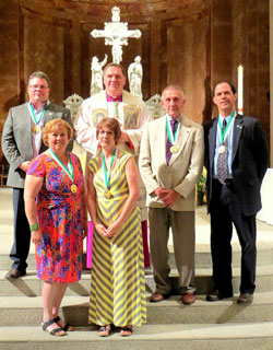 Archbishop Joseph W. Tobin poses for a photo with the 2015 recipients of the St. John Bosco Award, the highest honor of the archdiocese’s Catholic Youth Organization. The recipients in the front row are Marni Fey, left, and Amy Stimpson. The recipients in the back row are Ken Troy, left, John Kistner and Steve Battiato. The recipients received their awards on May 6 in the SS. Peter and Paul Cathedral in Indianapolis. (Submitted photo)