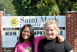 The close friendship of Kho Ti, left, and Sophie Albertson—two sixth-grade students at St. Mark School in Indianapolis—reflects the welcome that Burmese refugees have received in the past five years at St. Mark Parish and its school. (Photo by John Shaughnessy)