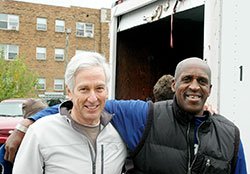 Leo Stenz, left, and Ennis Adams work together to help homeless people in Indianapolis transform their lives. On Oct. 31, the friends posed for a photo, taking a break from their efforts for the Beggars for the Poor ministry, which provides a meal, clothing and socialization for 200 homeless people every Saturday morning in downtown Indianapolis. (Photo by John Shaughnessy)