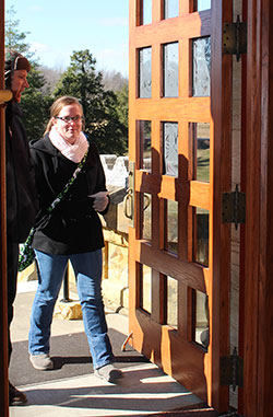 Alan Mathews, left, and Samantha Strom walk through the holy door at the Archabbey Church of Our Lady of Einsiedeln in St. Meinrad on Jan. 18. Mathews and Strom are faculty members of Our Lady of Providence Jr./Sr. High School in Clarksville who respectively teach Spanish and science. Providence’s faculty and staff went on a retreat focused on the Holy Year of Mercy at Saint Meinrad Archabbey. (Submitted photo) 