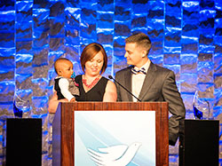 Jen and Joe Amschler share the story of adopting their son Jaxson during the St. Elizabeth Catholic Charities gala on April 21 at the Galt House hotel in Louisville. (Submitted photo)