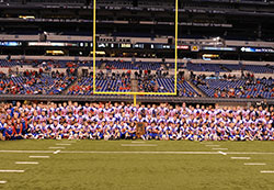The football team of Roncalli High School in Indianapolis is pictured on Nov. 25 in Lucas Oil Stadium in Indianapolis after winning the Indiana class 4A state football championship. (Submitted photo)