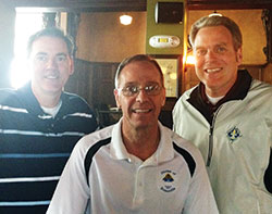 Archbishop Charles C. Thompson, center, posed for a photo with Steve Schulz, left, and Harry Freibert—two of his former teammates from Bellarmine University in Louisville where they ran cross country and track together. The photo was taken three years ago when Schulz and Freibert drove from Louisville to visit their friend, who was then the bishop of Evansville, Ind. (Submitted photo)