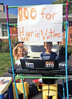 Will Lewis, a third-grade student at Holy Name of Jesus School in Beech Grove, came up with a unique way to raise money for hurricane victims. He offered to play people songs on his keyboard for donations. He raised $55.02. Will is pictured with his sister Kara. (Submitted photo)
