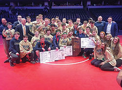 The wrestling team of Cathedral High School in Indianapolis celebrates its state championship on Feb 16. (Submitted photo)