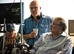 Chuck Konzelman, standing, and Cary Solomon, right, review a scene during the filming of Unplanned. The two co-wrote and co-directed the film. They also joined others in co-producing the film. (Submitted photo by Annette Biggers)