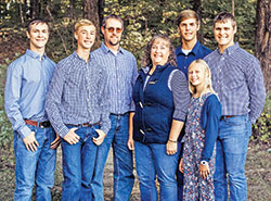 Indiana’s Choice Scholarships, commonly known as vouchers, have helped the five children of the Hoff family, members of St. Nicholas Parish in Ripley County, receive a Catholic education. David and Michelle Hoff, third and fourth from left, are the parents of Nicholas, left, Zachary, Jacob, Holly and Michael Hoff. (Submitted photo)