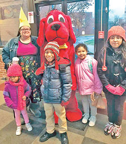 Showing her “young at heart” spirit in 
2019, Sarah Jean Watson, then principal of St. Lawrence School in Indianapolis, gets in on the fun with some of her students for a photo opportunity with Clifford the Big Red Dog. (Criterion file photo)