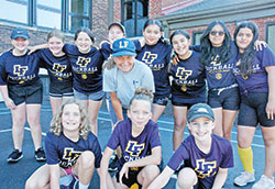 Antoinette Maio-Burford poses for a team photo with the fifth-and-sixth-grade kickball players she coaches at St. Therese of the Infant Jesus (Little Flower) Parish in Indianapolis. (Photo by John Shaughnessy)
