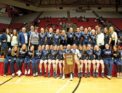 Players and coaches of the girls’ volleyball program of Our Lady of Providence High School in Clarksville are joined by school officials in posing for a celebratory photo after winning Indiana’s Class 3A state championship in the sport on Nov. 4 at Ball State University in Muncie, Ind. (Submitted photo)