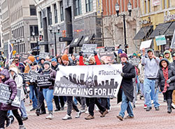 Members of St. John the Evangelist Parish in Indianapolis carry a banner during the Indiana March for Life on Jan. 23. (File photo by Natalie Hoefer)