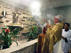 Bishop Donald J. Hying incenses the new perpetual adoration chapel at Our Lady of Guadalupe in East Chicago on Dec. 24. (Steve Euvino photo)