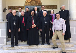 Bishop Emeritus Dale Melczek (front row, second from right) is pictured at the Coptic Catholic Patriarchy in Egypt in February with (front row, left to right) Maronite Bishop of Brooklyn, Gregory J. Mansour; Marionite Bishop of Cairo, Georges Chihane; Coptic Catholic Patriarch of Egypt, Ibrahim Issak, and CRS country representative Mourad Aidi. Among the patriarchy staff in the back row are pictured (fourth from left) CRS regional director Kevin Hartigan; director of Evangelization for the Diocese of Camden, Andres Arango; and CRS vice-president Michele Broemmelsiek. Melczek traveled Egypt with a contingent from Catholic Relief Services and assessed the charitiable initiatives of the organization. (CRS provided photo)