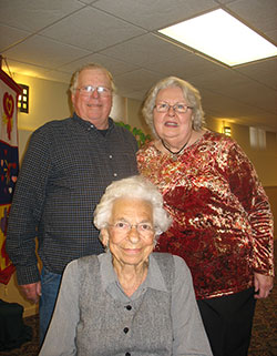 Jim and Sharon Garman (standing), co-president and secretary, respectively, of St. Michael and St. Anthony of Padua Harvest House movement, pose for a photo with past president Mary Ann Heitz. Jim was a maintenance worker at Immaculate Conception Parish, Auburn, and Sharon served as the director of religious education at St. Michael, Waterloo.