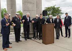 Evansville Mayor Lloyd Winnecke joins Bishop Charles C. Thompson and other presenters for a silent prayer during the May 5 observance of the 65th National Day of Prayer at Four Freedoms Monument in downtown Evansville. Photo by Daniel R. Patmore.