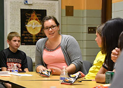 Emily Morton (center), a St. Patrick of Chesterton parishioner and Ball State University education major, instructs teen students during a session of Totus Tuus at St. Francis Xavier parish in Lake Station on June 22. Morton and three other teachers were trained earlier this summer in the youth-focused program named after St. Pope John Paul II's apostolic motto. (Anthony D. Alonzo photo)