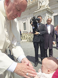 Pope Francis blesses Emma Frances Sumski after a papal audience in Rome on June 22. Emma and her family are parishioners of St. Maria Goretti Church in Westfield. (Photo provided)