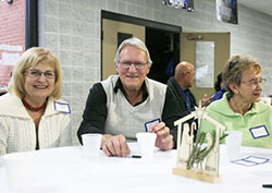 Lynn and John Clark, and Penny Pappas, all parishioners at St. Mary in Crown Point, share their thoughts about the role of mercy in everyday life during Family Advent Day at St. Mary's. The annual event drew almost 400 people or all ages. (Marlene A. Zloiza photo)