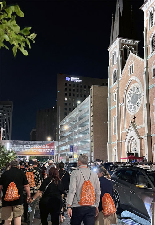 Congress-goers walk outdoors after the July 20 revival in Lucas Oil Stadium, held each night as part of the July 17-21 National Eucharistic Congress. (OSV News photo/Peter Jesserer Smith)
