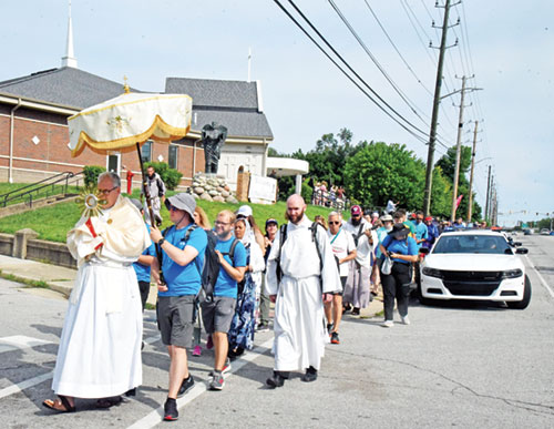 A eucharistic procession departs Holy Angels Parish for St. John the Evangelist Parish, both in Indianapolis, on July 16 as the last leg on the Marian (northern) Route of the National Eucharistic Procession. (Photo by Sean Gallagher)