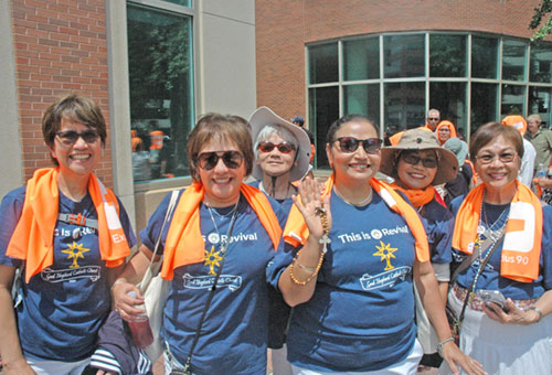 Parishioners from the Diocese of Sacramento, Calif., pose for a group photo outside the Indiana Convention Center in Indianapolis, one of the main venues for the National Eucharistic Congress. (Photo by John Shaughnessy)