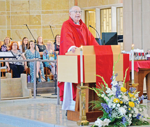 Father Robert Gilday preaches a homily during a June 29 Mass at St. Therese of the Infant Jesus (Little Flower) Church in Indianapolis. It was a liturgy that celebrated the 50th anniversary of his ordination to the priesthood. (Submitted photo)