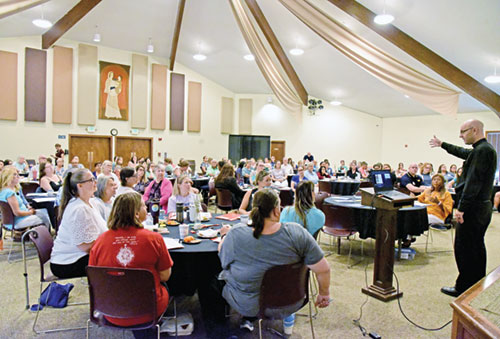 Father Michael Keucher gives a presentation on hope to people who serve archdiocesan youths. The talk was part of the Into the Heart workshop, sponsored by the archdiocesan Office of Youth Ministry, held at Our Lady of the Greenwood Parish in Greenwood on Aug. 9. (Photo by Sean Gallagher)