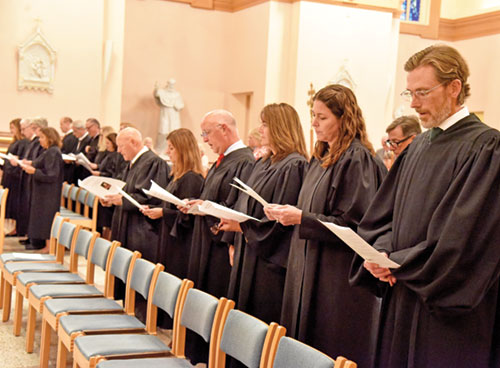 Wearing their courtroom robes, judges who serve in central Indiana worship together on Sept. 15 at SS. Peter and Paul Cathedral at the start of the annual Red Mass organized by the St. Thomas More Society of Central Indiana. (Photo by Sean Gallagher)