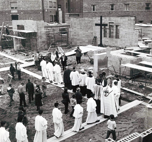 Archbishop Paul C. Schulte, priests and altar servers take part in a 1961 procession on the building site of St. Théresè of the Infant Jesus (Little Flower) Church in Indianapolis to bless the cornerstone of the east side faith community’s church. (Submitted photo)