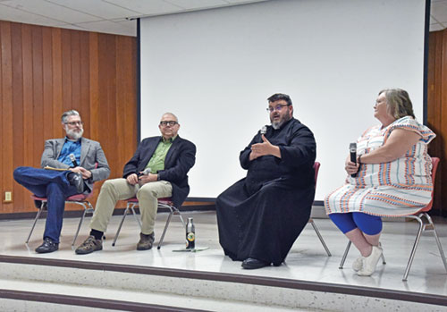 Eric Gudan, left, Peter Malinoski, Father Jerry Byrd and Jessica Inabnitt take part in a Sept. 12 panel discussion about suicide at Our Lady of the Most Holy Rosary Parish in Indianapolis. (Photo by Sean Gallagher)