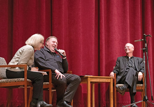 During a Nov. 5 session of  a conference titled “Deepening Communion in a Polarized World” at Saint Meinrad Seminary and School of Theology in St. Meinrad, Cardinal Joseph W. Tobin, center, archbishop of Newark, N.J. and former archbishop of Indianapolis, is joined in laughter by conference facilitator Dr. Amy Uleman, left, and Seattle Archbishop Paul D. Etienne, right, formerly a priest of the Archdiocese of Indianapolis. (Photo courtesy of Saint Meinrad Archabbey)