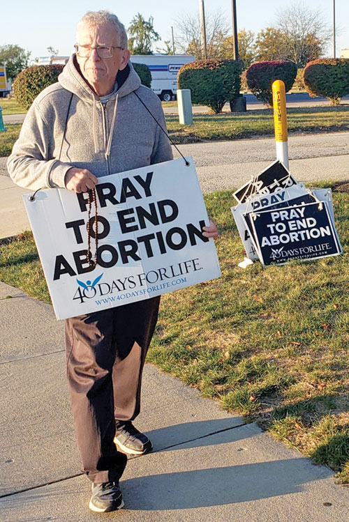 Steve Martin of St. Monica Parish in Indianapolis prays in front of a Planned Parenthood facility within his parish&rsquo;s boundaries on Oct. 22&mdash;five days before turning 80 and stepping down as St. Monica&rsquo;s pro-life committee chair after 49 years. (Photo by Natalie Hoefer)