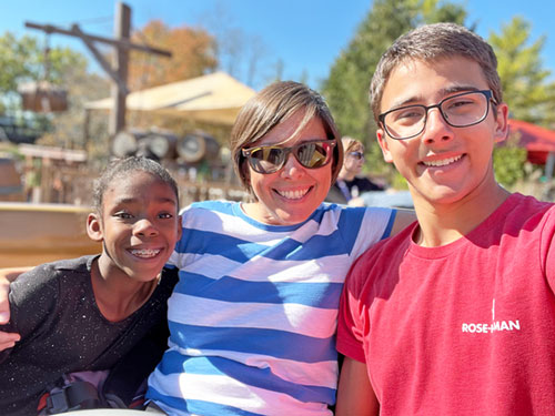 Nolan McCracken shares a moment of joy with his mother Becca and sister Ruby&mdash;two of the people that Nolan, in his talk before 16,000 people at the National Catholic Youth Conference in Indianapolis on Nov. 20, credited with bringing him closer to God. (Submitted photo)