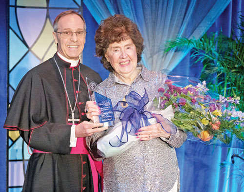 Archbishop Charles C. Thompson presents the archdiocese&rsquo;s Legacy Award to Patricia Etling during the Legacy Gala at the JW Marriott in Indianapolis on Feb. 6. (Photo courtesy of Denis Ryan Kelly Jr.)