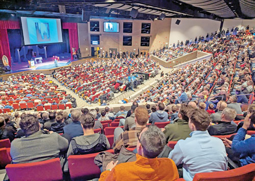 Father Jonathan Meyer leads some 1,500 men in praying the rosary on Feb. 21 in the auditorium of East Central High School in St. Leon during the 11th annual E6 Catholic Men&rsquo;s Conference organized by All Saints Parish in Dearborn County. (Photos by Sean Gallagher)