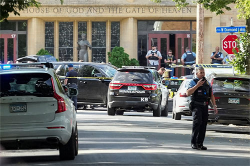 First responders block off the crime scene following a mass shooting at Annunciation Catholic School in Minneapolis Aug. 27, 2025. The shooter opened fire with a rifle through the windows of a the school's church and struck children celebrating Mass during the first week of school, killing two and wounding 17 people in an act of violence the police chief called "absolutely incomprehensible." (OSV News photo/Tim Evans, Reuters)