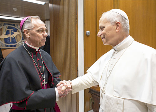Pope Leo XIV talks with Archbishop Charles C. Thompson of Indianapolis and members of a pilgrimage organized by the U.S. bishops' Committee for Evangelization and Catechesis for the Jubilee of Catechists at the Vatican Sept. 27, 2025. (CNS photo/Vatican Media)