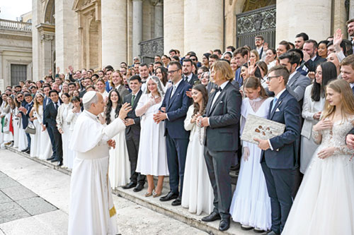 Pope Leo XIV greets newlywed couples who came for a blessing at his weekly general audience in St. Peter&rsquo;s Square at the Vatican on Nov. 19. (CNS photo/Vatican Media)