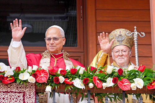 Pope Leo XIV and Orthodox Ecumenical Patriarch Bartholomew of Constantinople greet people from a balcony following a Divine Liturgy celebrated in the Patriarchal Cathedral of St. George in Istanbul on Nov. 30. (CNS photo/Lola Gomez)