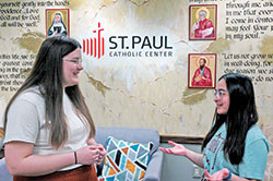 Emma Schuler, left, the Catholic campus minister for Indiana University in Bloomington, chats with Maria Thomas, a first-year student at IU from St. Mark the Evangelist Parish in Indianapolis. (Photo by John Shaughnessy)